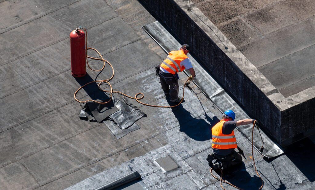 DIY vs. Professional Flat Roofing Repairs